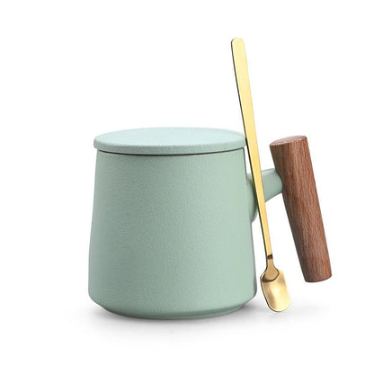 Stylish premium gifts set in a beautiful box. Stoneware teacup with lid and spoon in gift ready packaging.