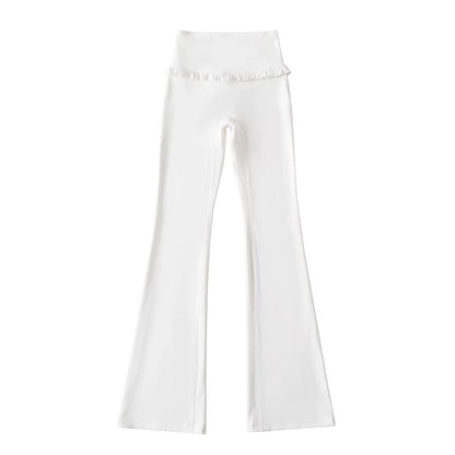 High‑waist flared yoga pants with subtle ruffle detail