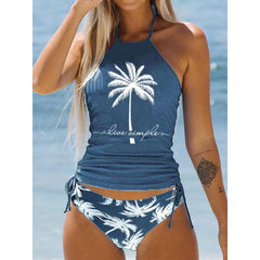 Halter tankini swimsuit with graphic design and adjustable side tie bottoms shown from the front. This women’s graphic tankini swimsuit features a wireless halter top with light padding for comfortable beach and vacation wear.