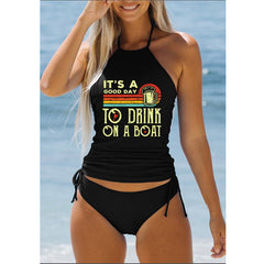 Graphic halter tankini swimsuit featuring adjustable side tie bikini bottoms for a customizable fit. This women’s tankini swimsuit is designed for poolside lounging, beach days, and resort vacations.
