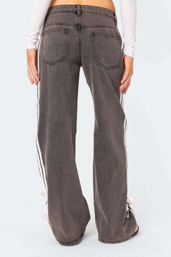 Modern Striped Distressed Loose-Fit Jeans for casual fashion. Trendy jeans with high-quality denim material. Comfortable fit with stylish striped design. Distressed look adds a unique touch to your outfit. Versatile wardrobe staple for fashion-forward individuals. 