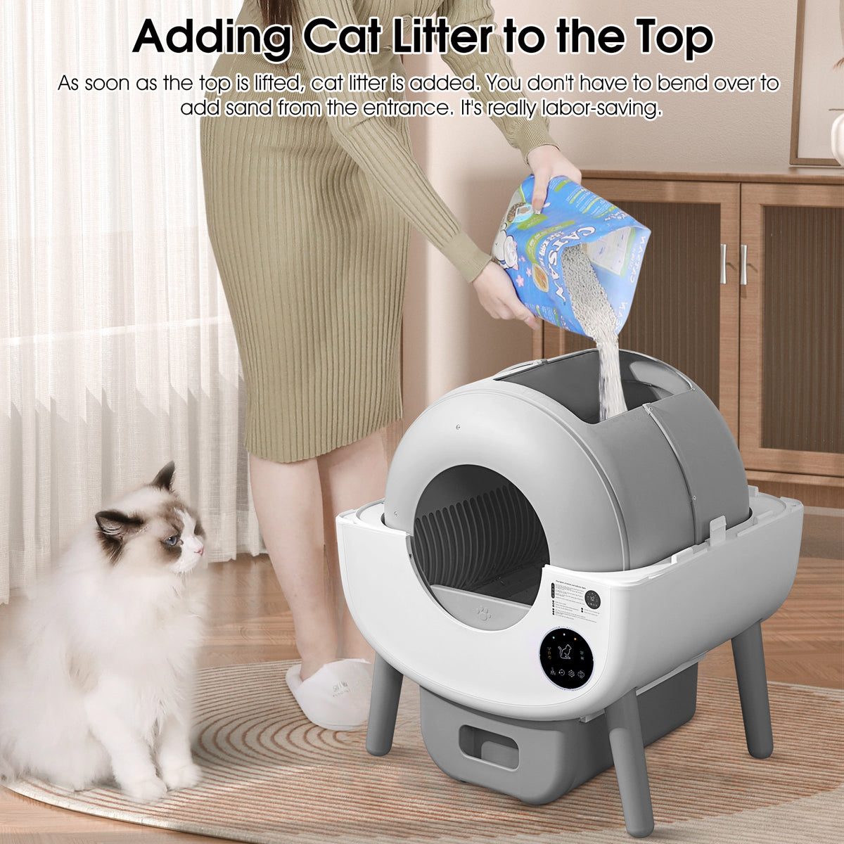 Adding cat litter through the top of the self-cleaning litter box
