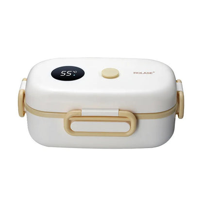 Hot lunch container for school. Thermal food container with LCD display. Heated lunch box placed on a desk with a healthy snack. Durable plastic lunch box with leak-resistant lid and modern design. 