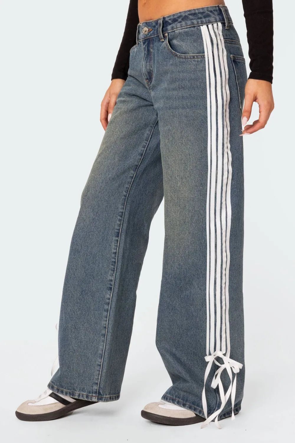 Lose fit modern dark blue jeans with stripes. Embellished mid rise loose jeans for her.