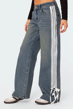 Lose fit modern dark blue jeans with stripes. Embellished mid rise loose jeans for her.